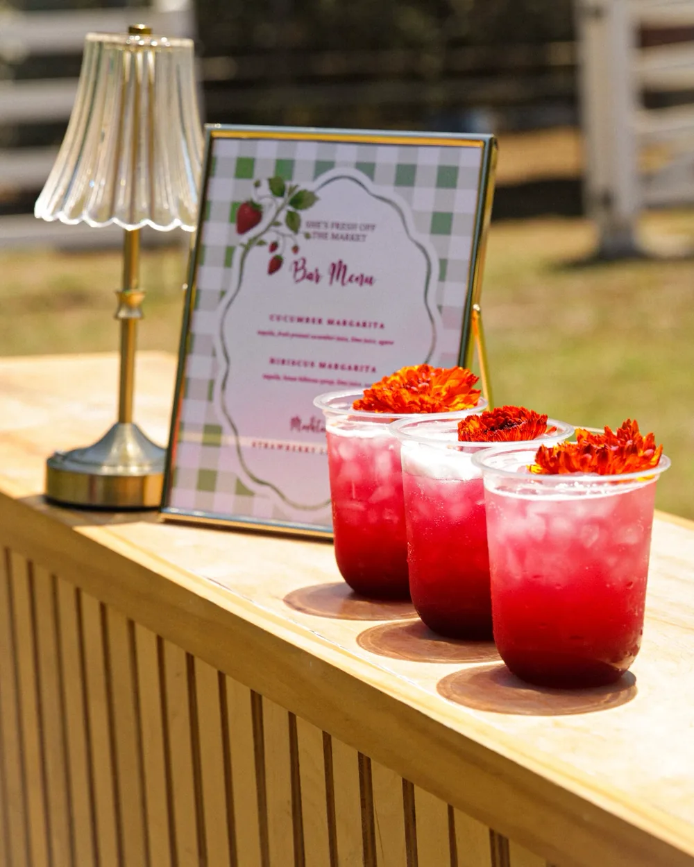 The Flute bar, a reeded natural wood mobile bar with a printed menu