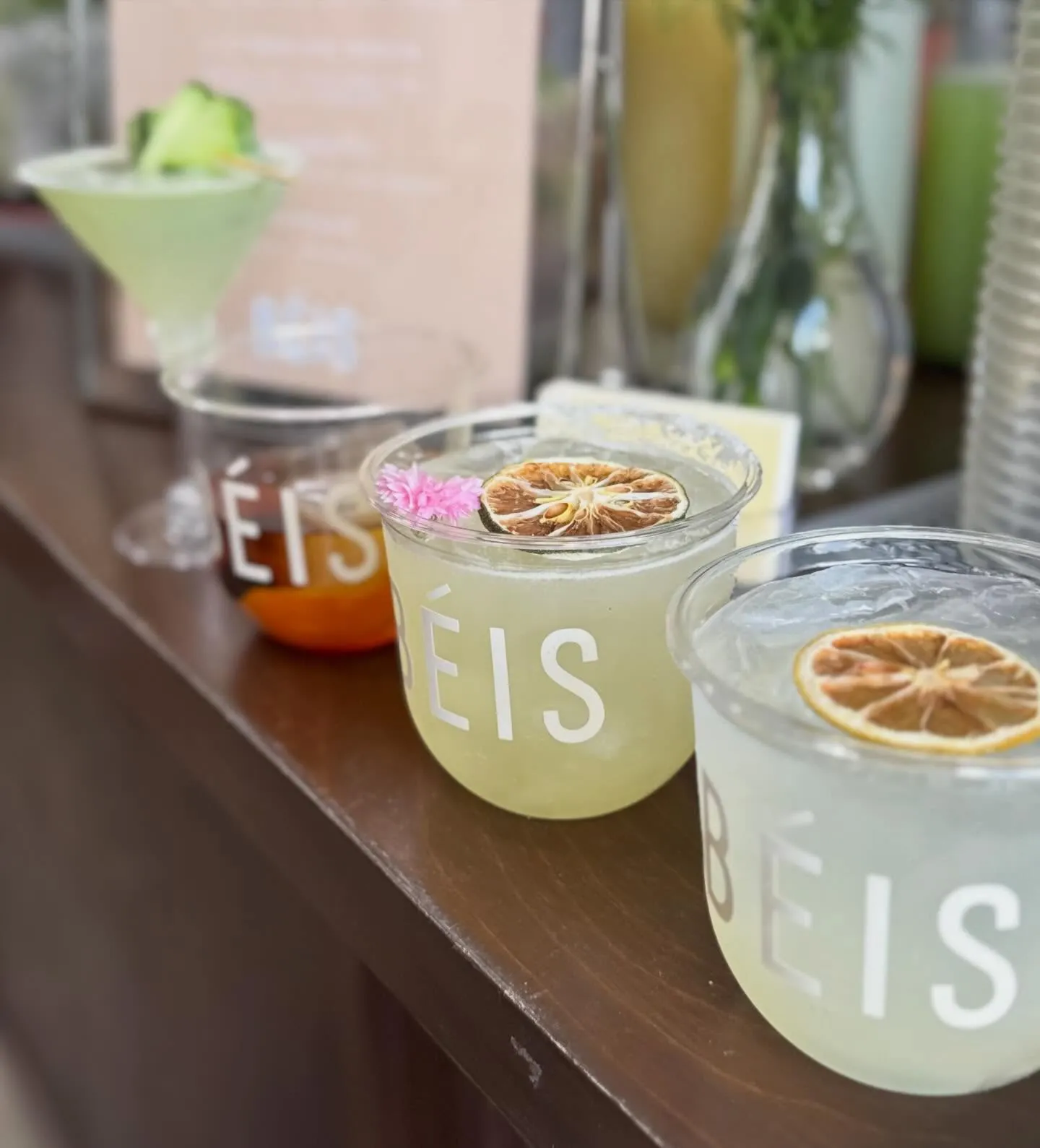 Cocktail cups printed with the BÉIS wordmark